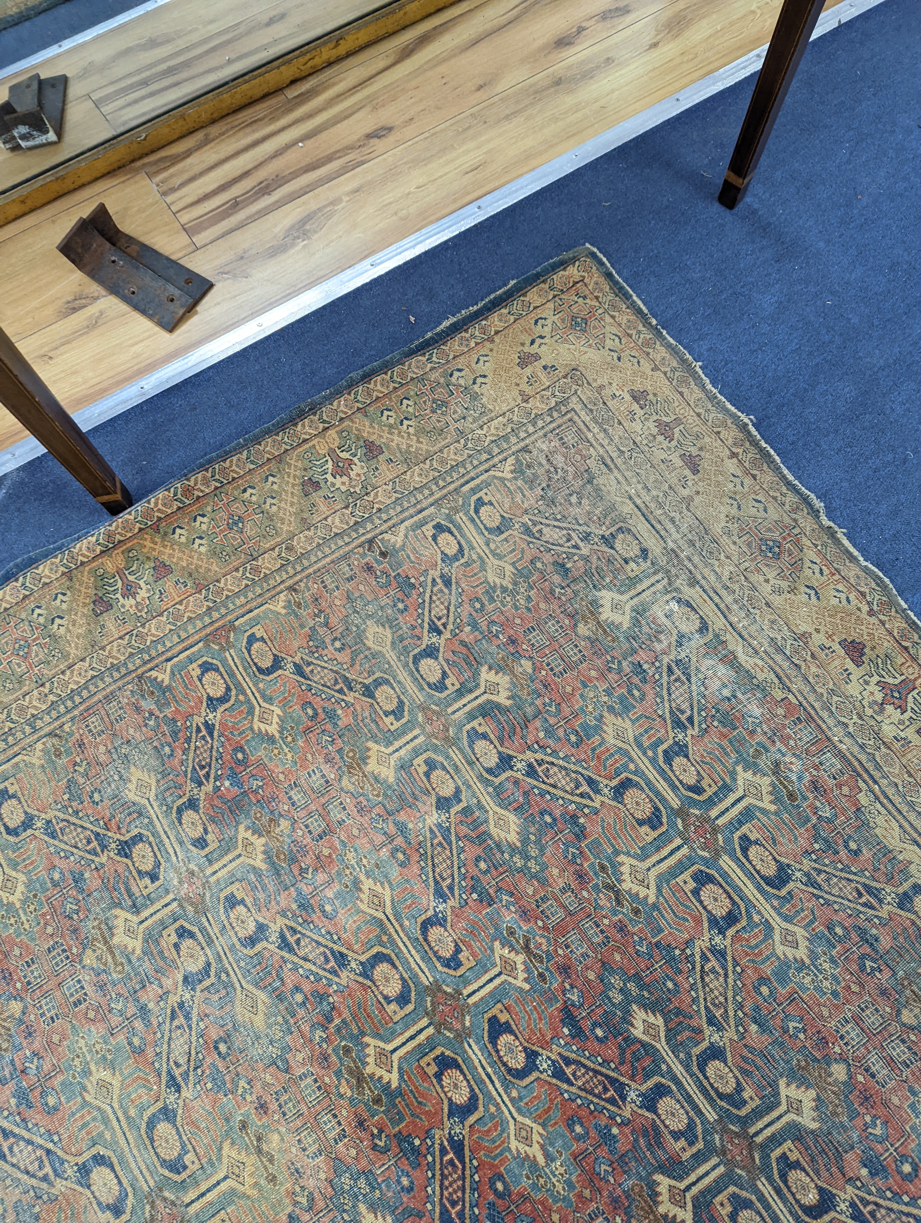 Three antique rugs, Caucasian and North West Persian, largest 230 x 154cm